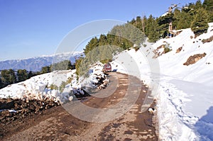 A narrow track through the snow covered mountains