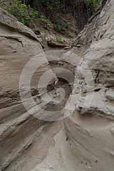 The narrow walls of the Los Hoyos trail in the gray desert of Tatacoa, Colombia photo