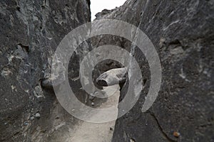 The narrow walls of the Los Hoyos trail in the gray desert of Tatacoa, Colombia photo