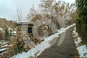 Narrow and weathered pathway on a snowy hill in Salt Lake City in winter