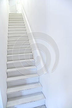 Narrow white ladder stair