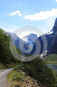 The narrow and winding road leads into the glacier in Loen, Stryn.