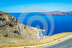 Narrow winding road to Thira Santorini port Caldera seascape Greece