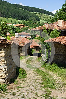 The narrow winding street in the Balkan village