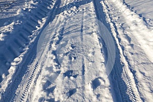 narrow winter road , closeup