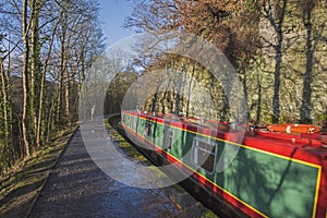 Narrowboat on a British canal in rural setting