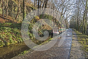 Narrowboat on a British canal in rural setting