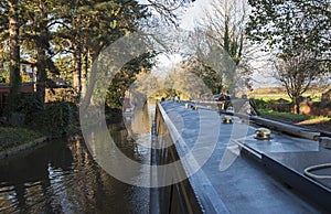 Narrowboat on a British canal in rural setting