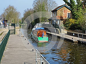 Narrowboat leaving a Lock on the River Thames photo