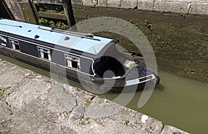 Narrowboat passing through a lock