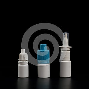 Nasal spray and droppers on black isolated background