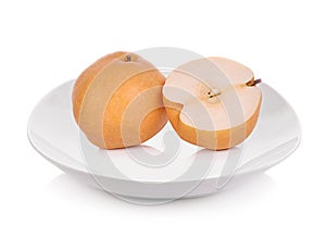 Nashi pear fruit on plate over white background