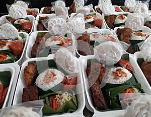 Nasi box. Mixed rice with vegetable and fried chicken. rice in styrofoam box