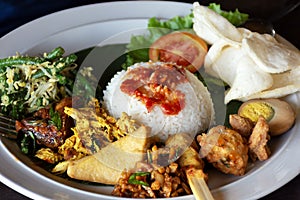 Nasi campur Bali or also known as Balinese mixed rice photo