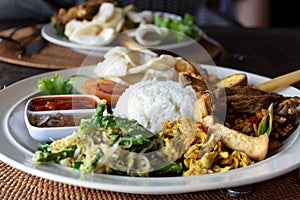 Nasi Campur Bebek Goreng or also known as Mixed rice with duck meat photo