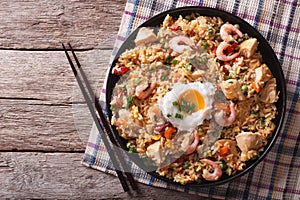 Nasi goreng with chicken, prawns, egg and vegetables horizontal