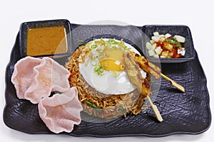 Nasi goreng, literally meaning fried rice in Indonesian, serve with chicken and shrimps photo