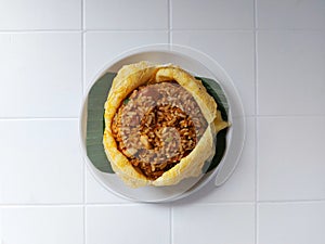 Nasi goreng selimut or fried rice covered in egg omelette