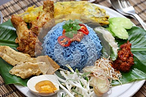Nasi kerabu, blue color rice salad, malaysian cuisine