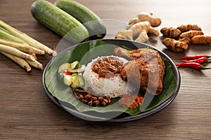 Nasi Kukus is usually comprising freshly steamed rice and crispy fried chicken