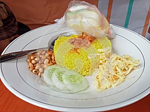Nasi Kuning is food tradisional of Java Indonesia photo