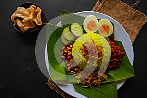 Nasi kuning or yellow rice or tumeric rice is traditional food from asia