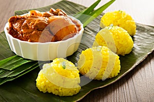 Nasi Kunyit also known as Turmeric Glutinous Rice. Normally eaten with dry curry chicken