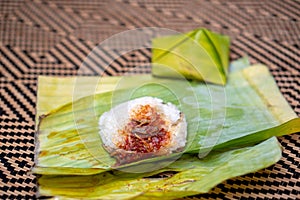 Nasi lemak is a Malay fragrant rice dish cooked in coconut milk and pandan or banana leaf