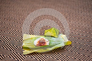 Nasi lemak is a Malay fragrant rice dish cooked in coconut milk and pandan or banana leaf