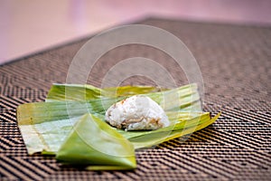 Nasi lemak is a Malay fragrant rice dish cooked in coconut milk and pandan or banana leaf