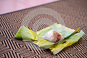 Nasi lemak is a Malay fragrant rice dish cooked in coconut milk and pandan or banana leaf