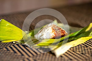 Nasi lemak is a Malay fragrant rice dish cooked in coconut milk and pandan or banana leaf