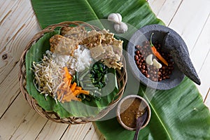 Nasi pecel. vegetable with peanut sauce photo