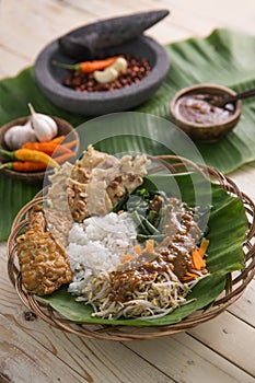 Nasi pecel. vegetable with peanut sauce photo