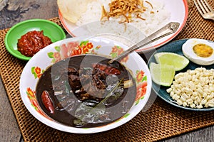 nasi rawon, Indonesian black beef soup with rice. photo