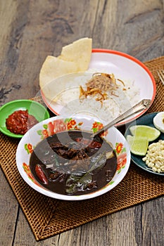 nasi rawon, Indonesian black beef soup with rice. photo