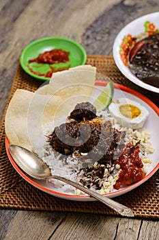 nasi rawon, Indonesian black beef soup with rice. photo