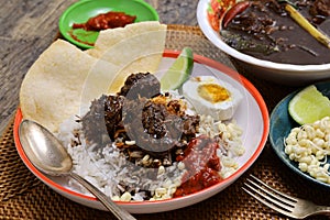 nasi rawon, Indonesian black beef soup with rice. photo