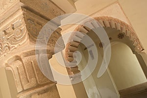 Chapiter column and Nasrid arch in muslim palace of Alcazaba, Malaga, Spain photo