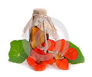 Nasturtium flowers with a pharmaceutical bottle.