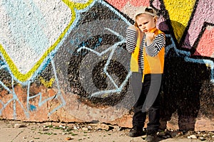 Nasty angry little girl outside showing fists