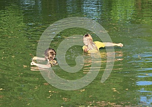 Nasty kids in clothes soaking wet in water