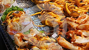 National Asian Exotic ready to eat seafood at night street market food court in Thailand. Delicious Grilled Prawns or