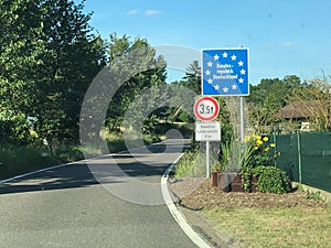 National border roadsign entering Federal Republic of Germany, with stars on blue as symbols for European Union member
