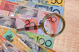 National currency. Colorful australian dollar banknotes on wooden table close up