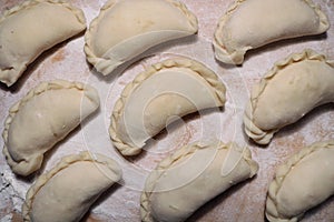 National dish dumplings on a wooden surface.