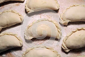 National dish dumplings on a wooden surface.