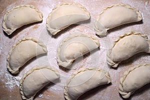 National dish dumplings on a wooden surface.