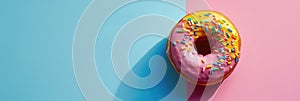 National Donut Day, one pink donut covered with icing and confetti, striped blue and pink background, copy