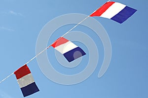 National Dutch flags of the Netherlands in a blue sky